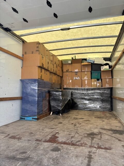 Moving truck loaded with protected furniture